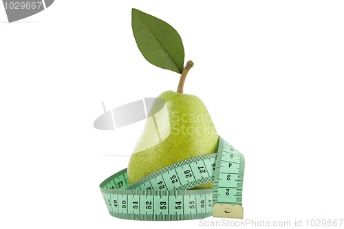 Image of green pear with leaf and measurement tape