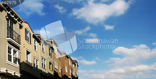 Image of Modern houses and sky with clouds