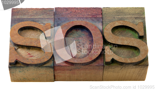 Image of sos sign in letterpress type