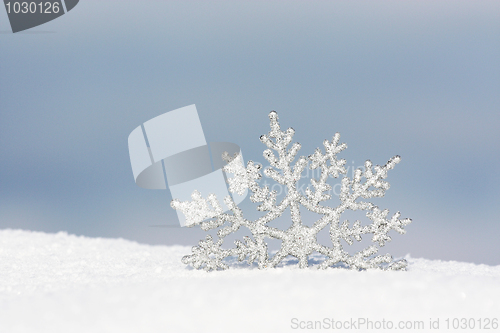 Image of snowflake in snow