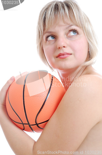 Image of beautiful blond woman with a ball