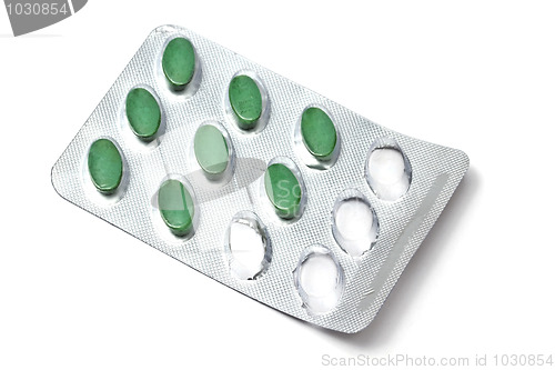Image of green pills isolated on white 