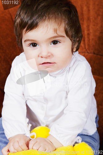 Image of Cute baby girl with toy