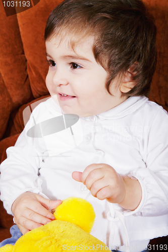 Image of Cute baby girl with soft toy