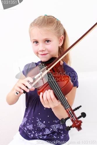 Image of Little girl playing violin