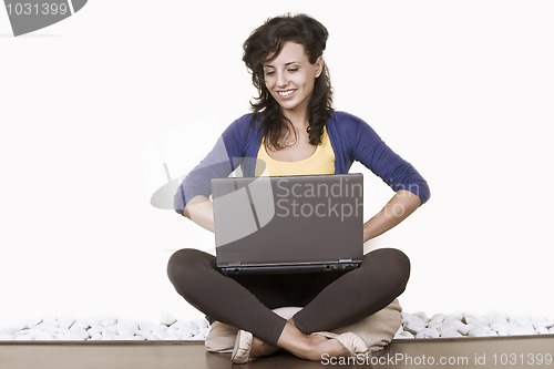 Image of relaxed woman working on notebook