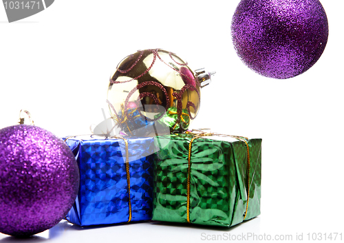 Image of Christmas gift box with christmas balls on white