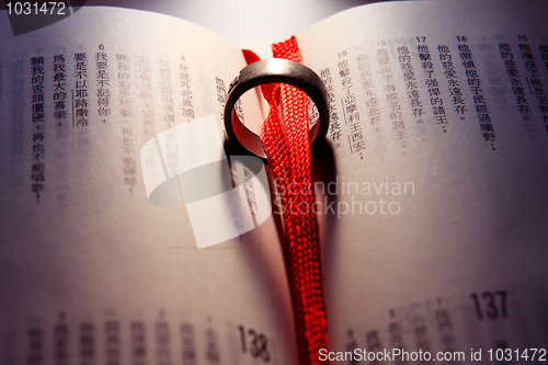 Image of Wedding Ring on a chinese bible