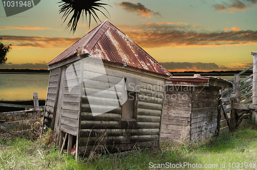 Image of Dilapidated Huts By The Water