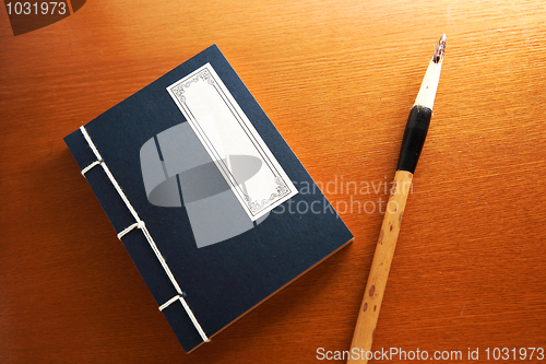 Image of chinese book and writing brush