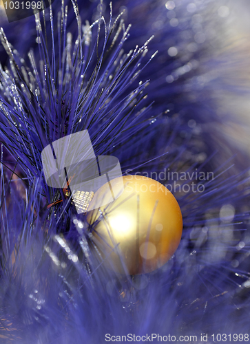 Image of christmas ball on blue color christmas tree