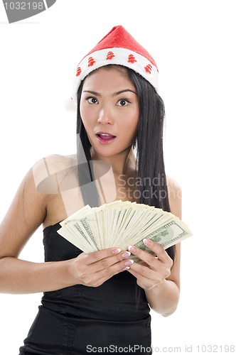 Image of woman with santa claus hat and money