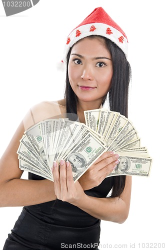 Image of woman with santa claus hat and money