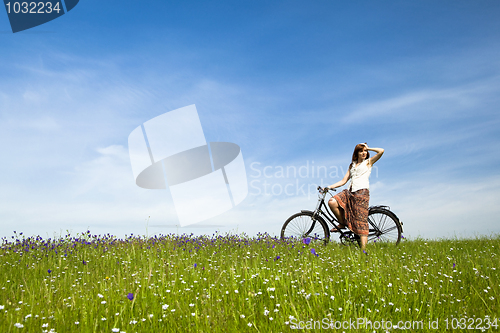 Image of Girl with a bicycle