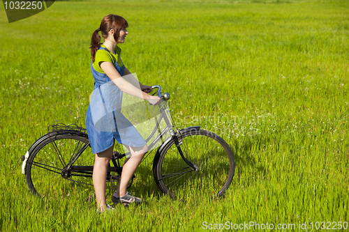 Image of Girl with a bicycle