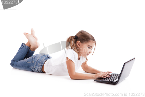 Image of Little student girl with a laptop