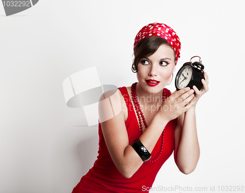 Image of Girl holding a clock