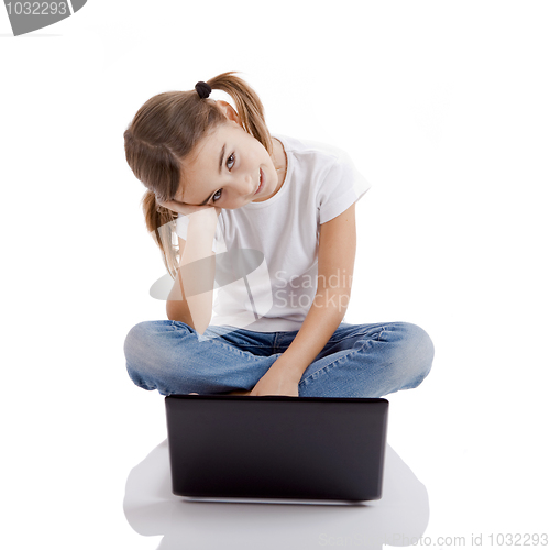Image of Little student girl with a laptop