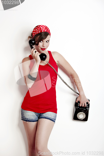 Image of Girl with a vintage phone