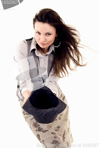 Image of Young brunette holding a hat    