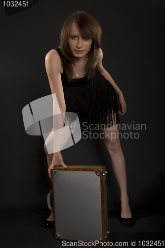 Image of A girl with suitcase   