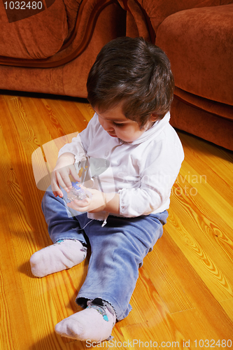 Image of Cute baby girl on floor