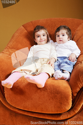 Image of Sisters sitting in chair