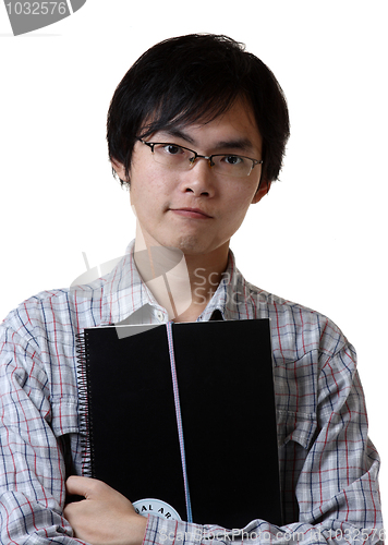 Image of student hand holding book