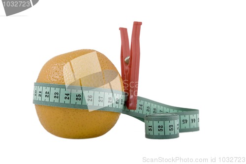 Image of Fresh orange with measuring tape