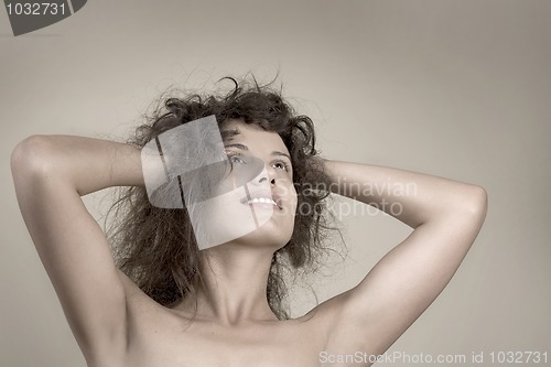 Image of Beautiful face of young woman with curly hairs