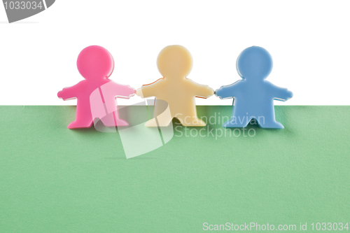 Image of 3 male figurines on blank paper