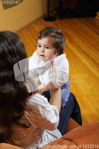 Image of Baby girl looking at mommy