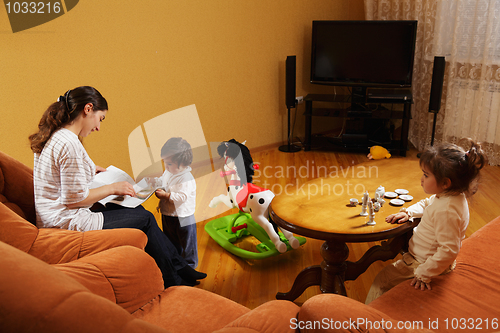 Image of Mother with daughters at home