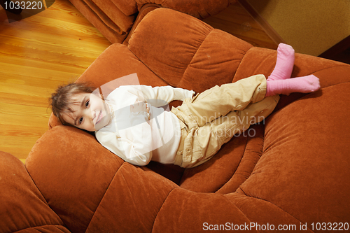 Image of Smiling girl in big chair
