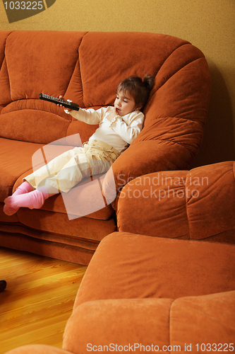 Image of Child with remote control sideview