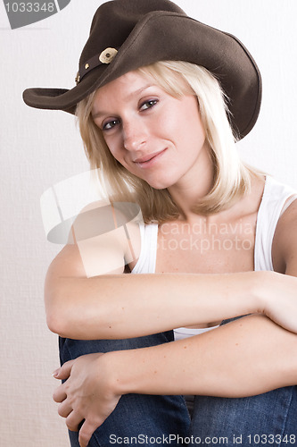 Image of western woman in cowboy shirt and hat