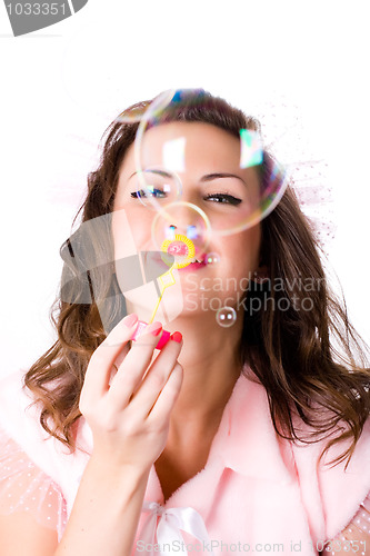 Image of  pretty girl blowing soap bubbles 