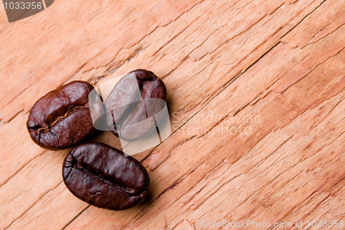 Image of three fried coffee beans