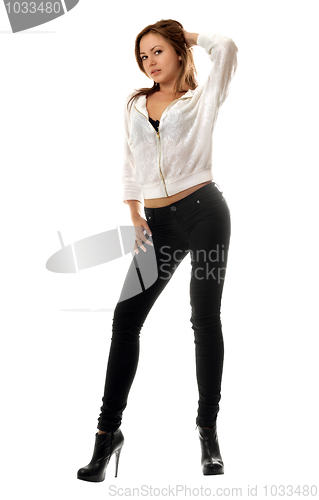 Image of young woman in black tight jeans