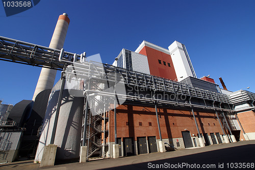 Image of Modern industrial factory against blue sky