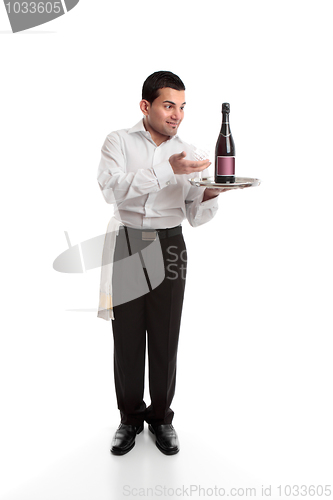 Image of Waiter presenting a bottle of alcohol