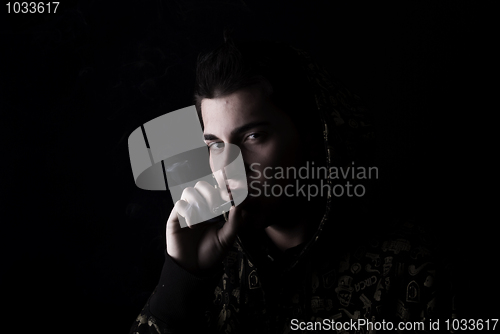 Image of portrait of a young man with cigarette  