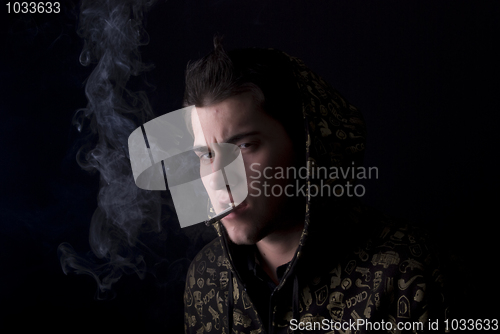 Image of portrait of a young man with cigarette  
