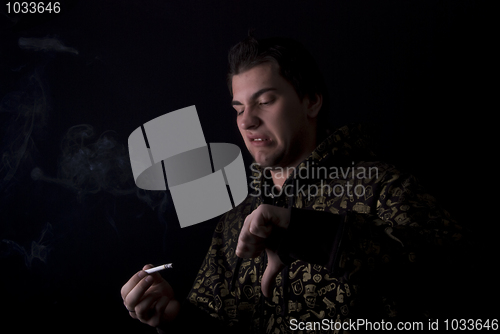 Image of portrait of a young man with cigarette