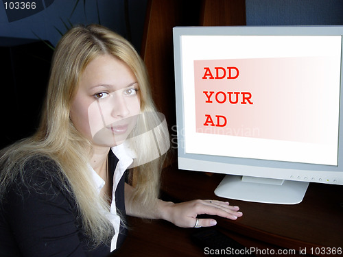 Image of Blond girl and computer monitor