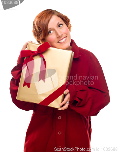 Image of Pretty Red Haired Girl with Wrapped Gift Isolated