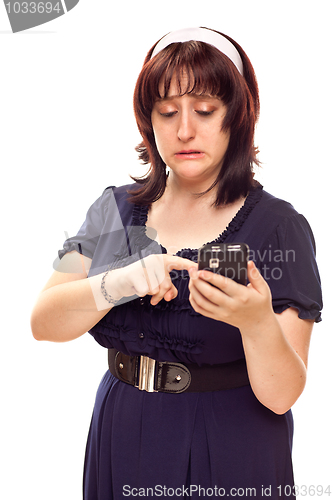 Image of Reluctant Young Caucasian Woman Texting On Mobile Phone