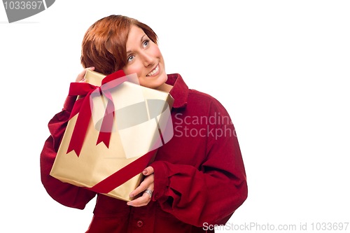 Image of Pretty Red Haired Girl with Wrapped Gift Isolated