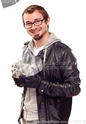 Image of Warmly Dressed Handsome Young Man with Gift