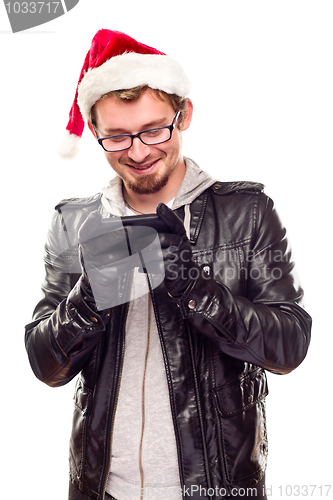 Image of Young Man with Santa Hat Using Cell Phone